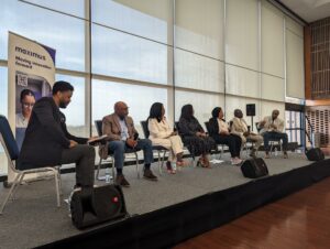 Panel of speakers on stage