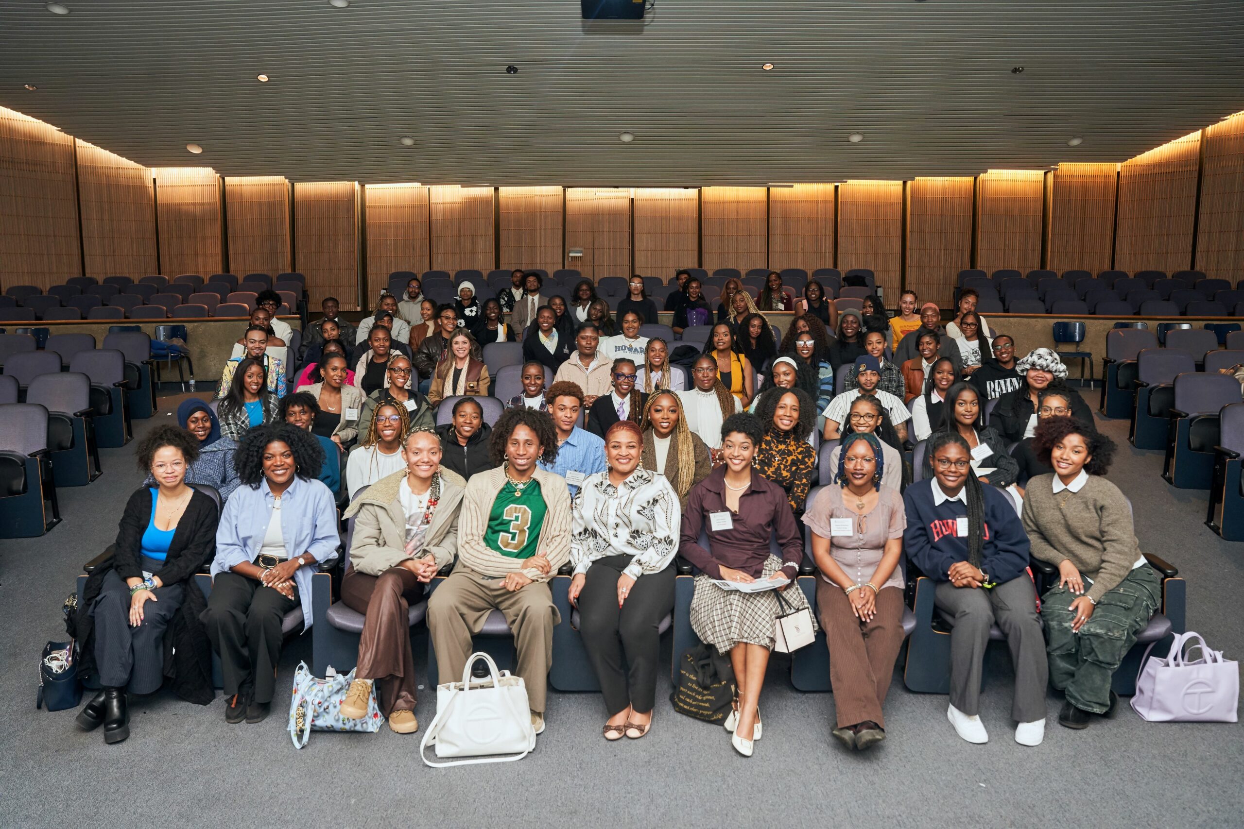 group of individuals seated in auditorium