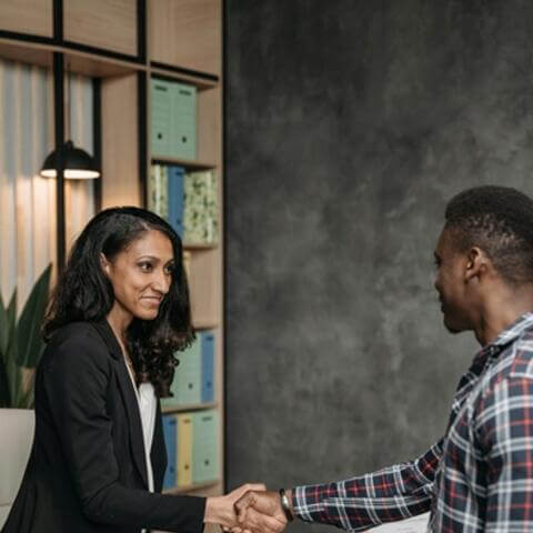 2 people shaking hands