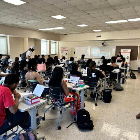 Photos of the back of students in chairs